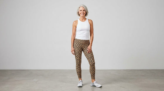 Best animal print leggings for women — silver-haired woman wearing leopard print leggings in a studio setting